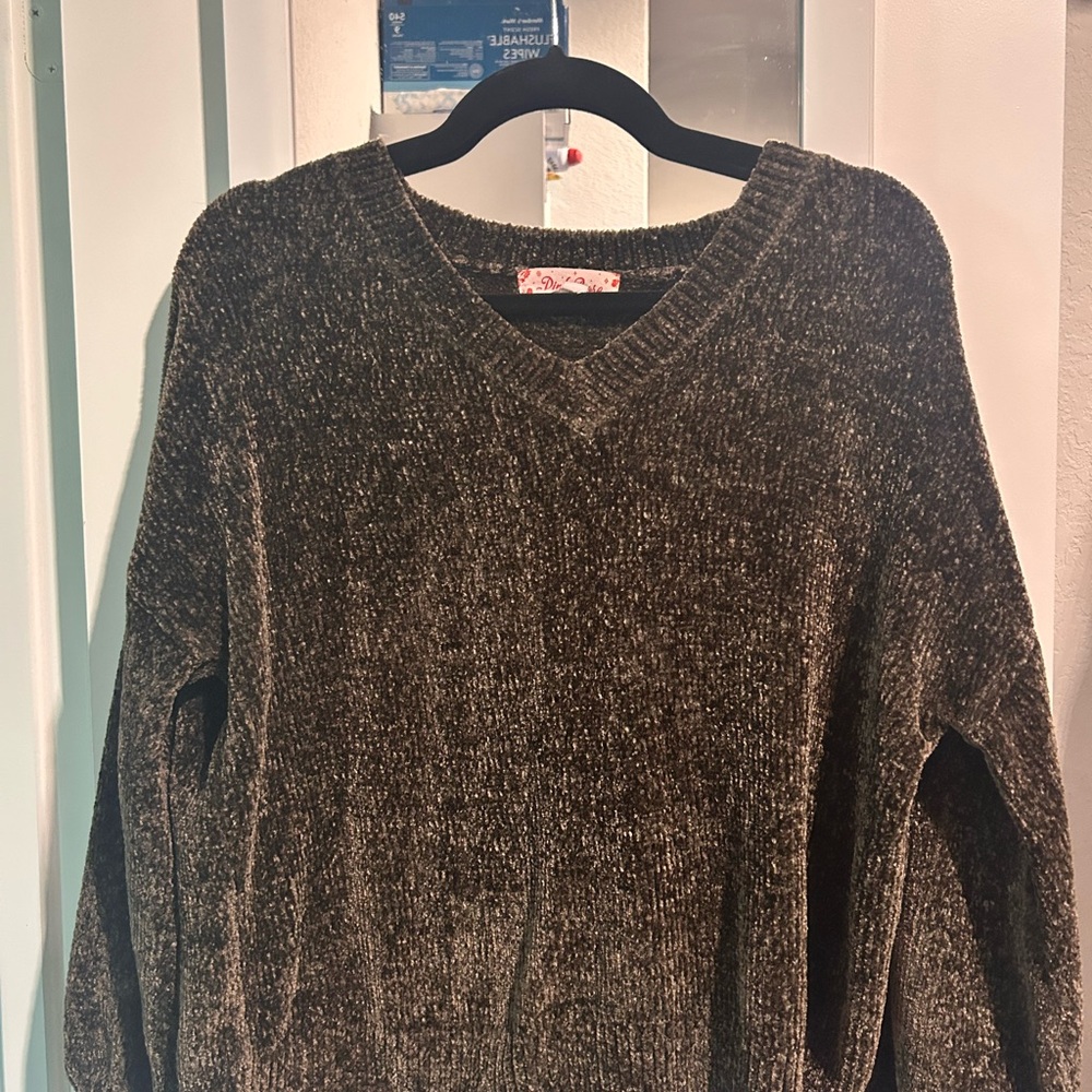 Woman’s green Sweater